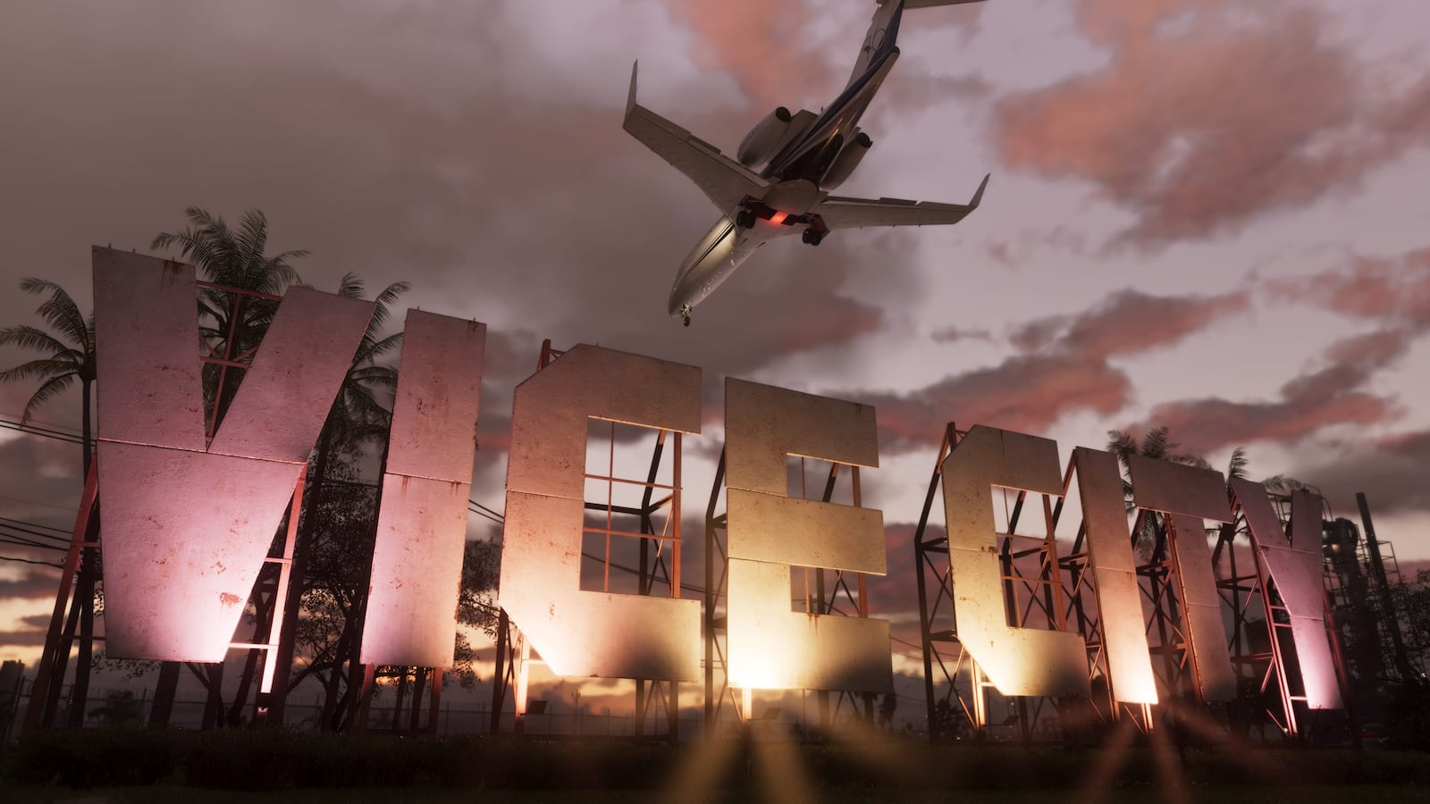 A passenger jet flying over the illuminated VICE sign at sunset