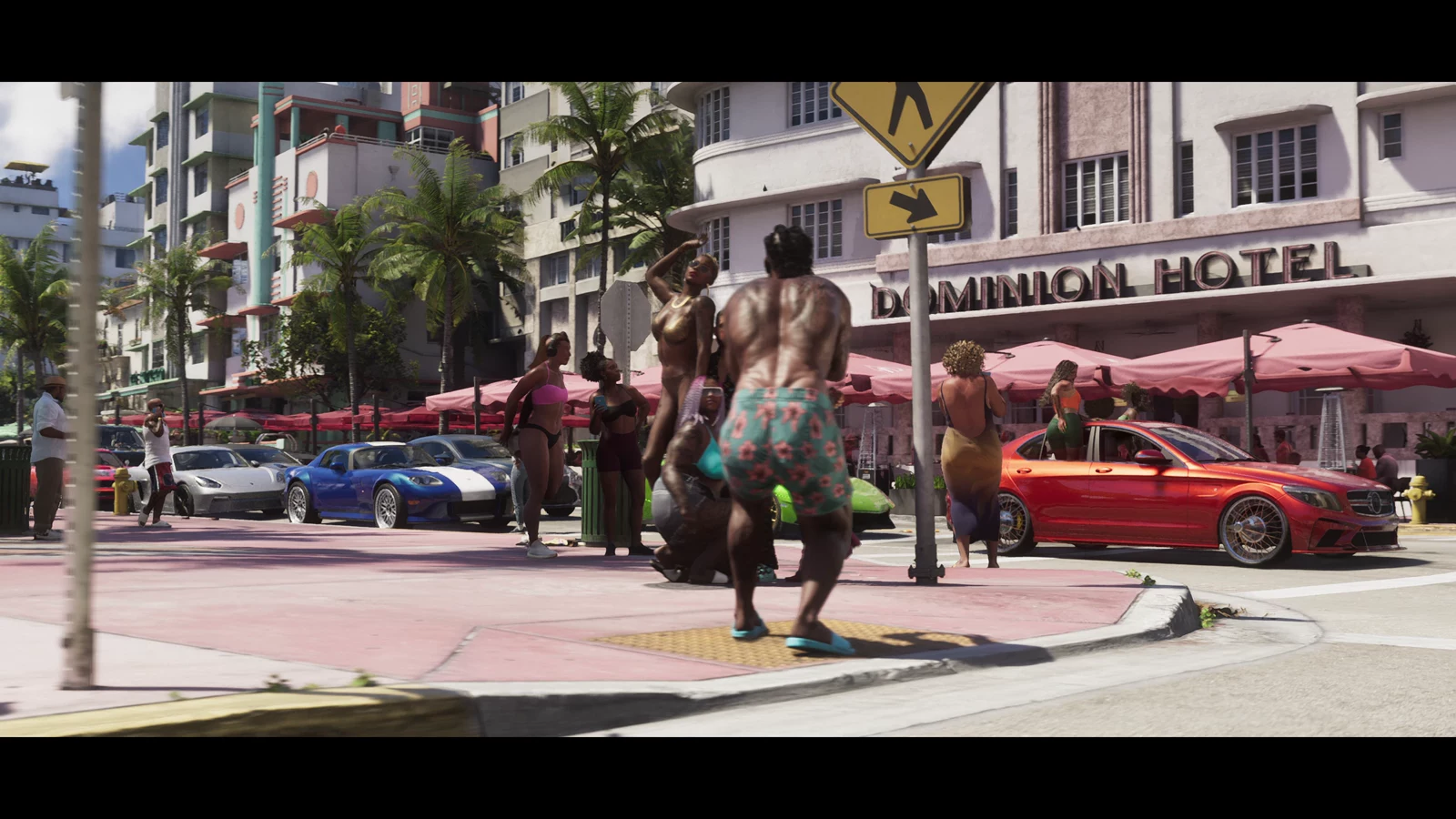 A busy pastel hotel street outside the Dominion Hotel in GTA VI Trailer 2